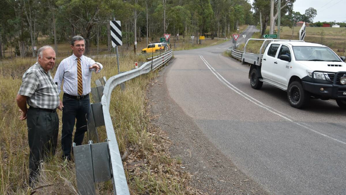 SAFETY: Federal member for Lyne Dr Gillespie inspects the Dungog Road north of Horns Crossing Road at Martins Creek with Dungog Mayor Cr Harold Johnston.