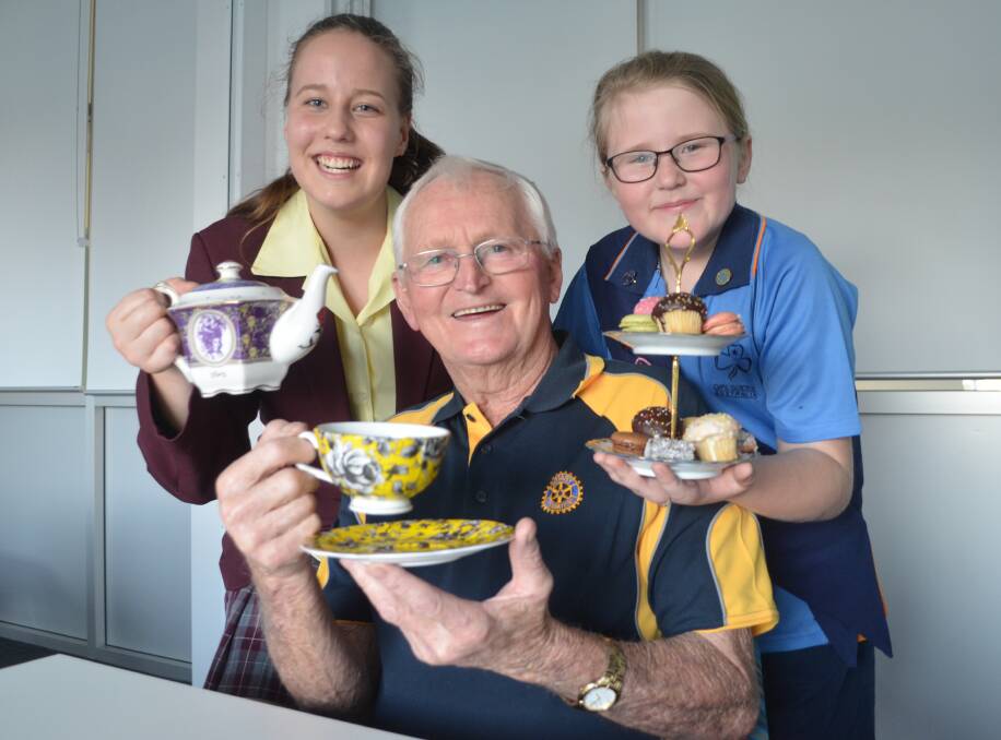 TIME FOR TEA: Rutherford Interact president Zoe Fletcher, Rutherford-Telarah Rotary past president Kevin Wilcher and Rutherford Girl Guides' Ember Rose.
