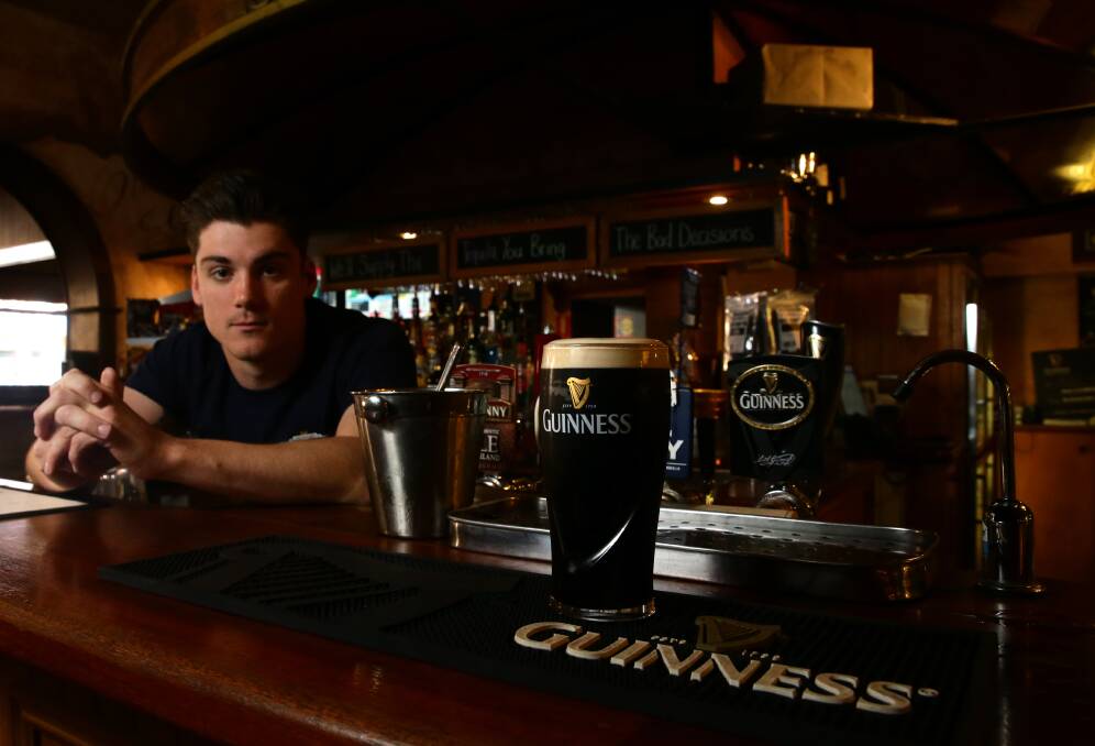 GUINNESS RECORD: Alex Wilmore behind the bar at Shenanigans at The Imperial Hotel Maitland. Picture Jonathan Carroll.