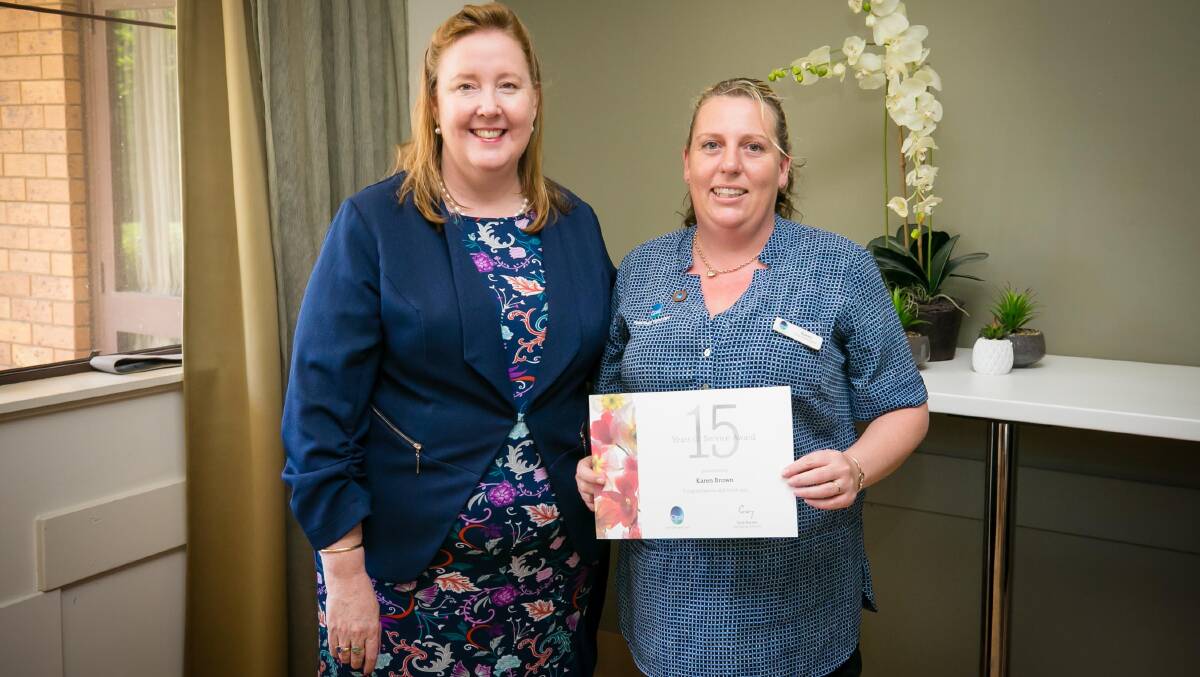 SHE'S A GEM: Opal nurse Karen Brown pictured receiving her award for 15 years' service from member for Maitland Jenny Aitchison.