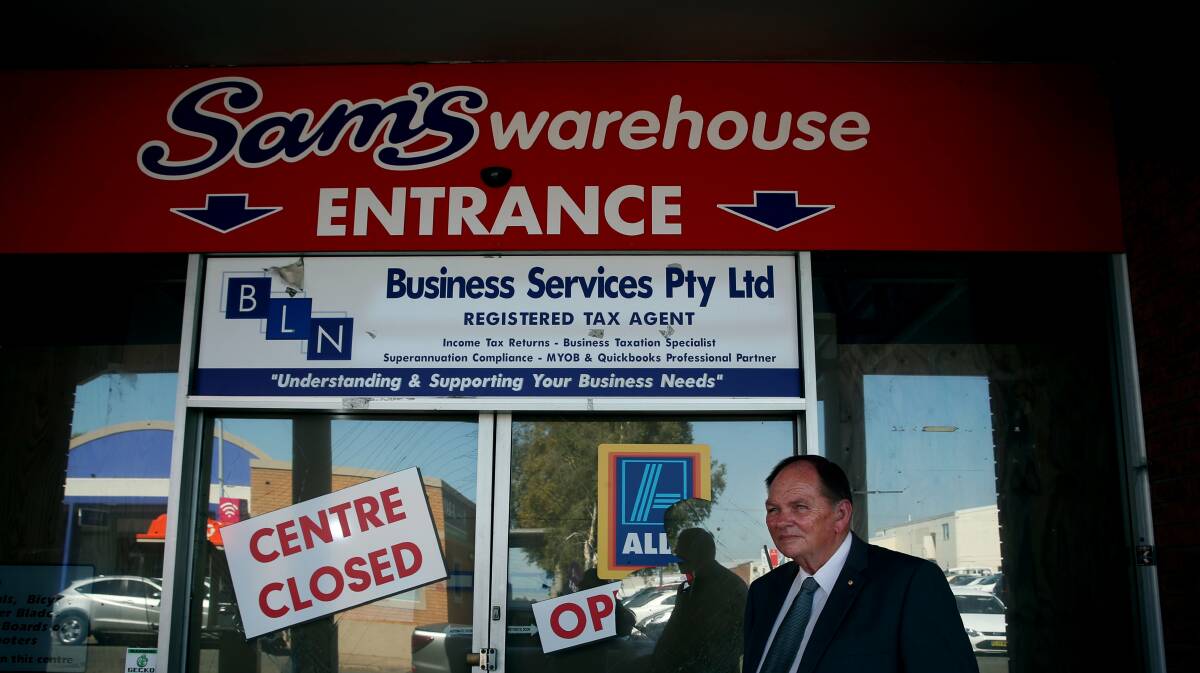 Mayor Peter Blackmore outside the old Sam's Warehouse building.