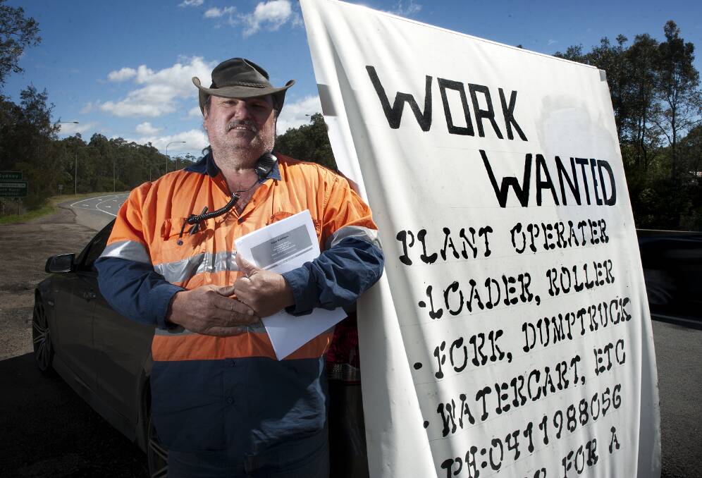 TAKIN' IT TO THE STREETS: Peter Robinson on the job on the New England Highway at Tarro. PICTURE: Perry Duffin.