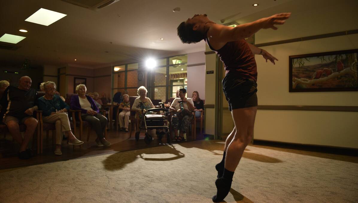 WORLD AT HIS FEET: Jay Tickle performing for Benhome residents. Picture: PERRY DUFFIN.