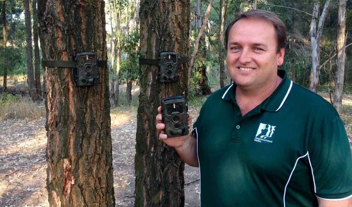 BIG BROTHER: Bill Hackney pictured with the free CCTV cameras.