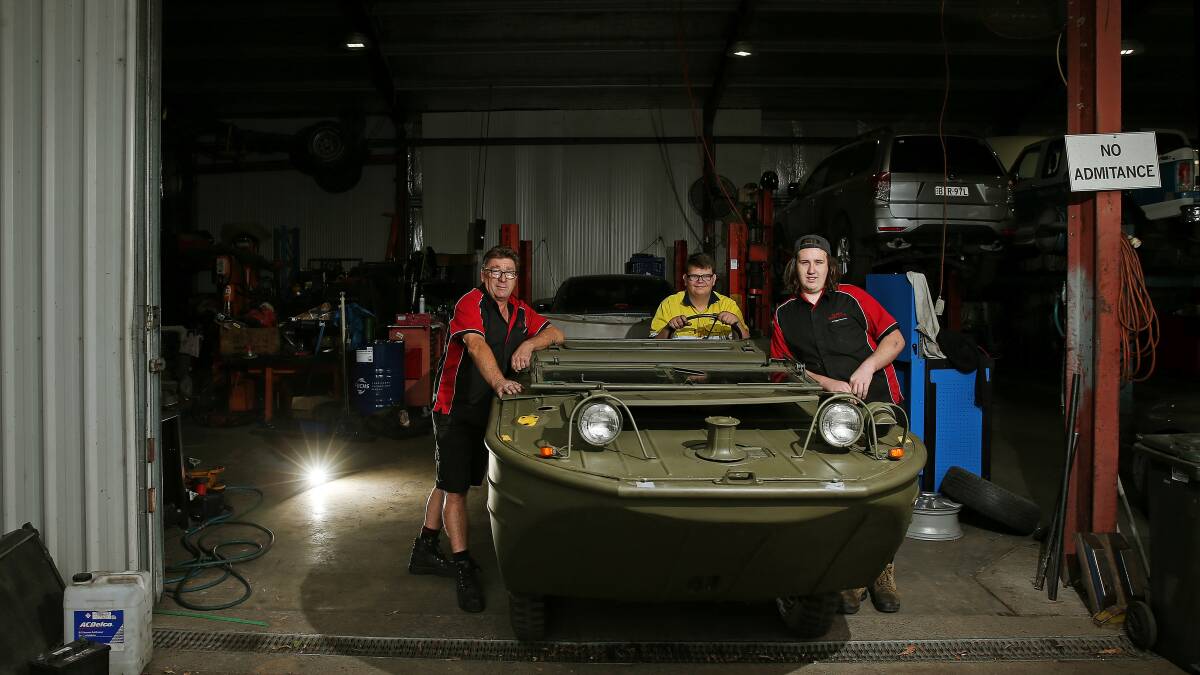 JEEPSTERS: Robert McShane, Alex Gardiner from Hunter Trade College and Jacob Larkin with the Jeep. Picture: Marina Neil.

