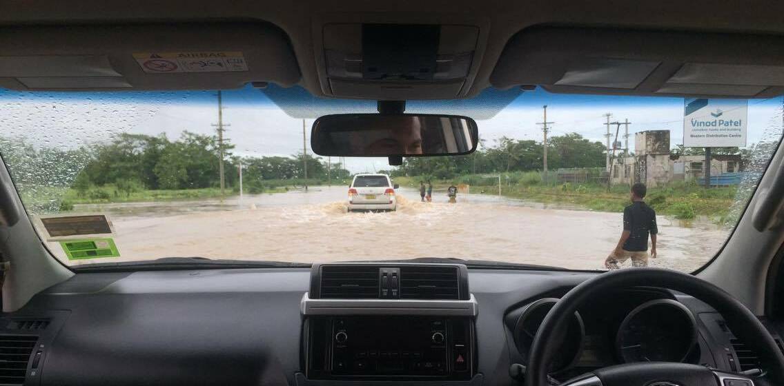 FRIGHTENING DRIVE: James Sharpe drives through floodwater in Fiji just hours before cyclone Zena hit the holiday destination.