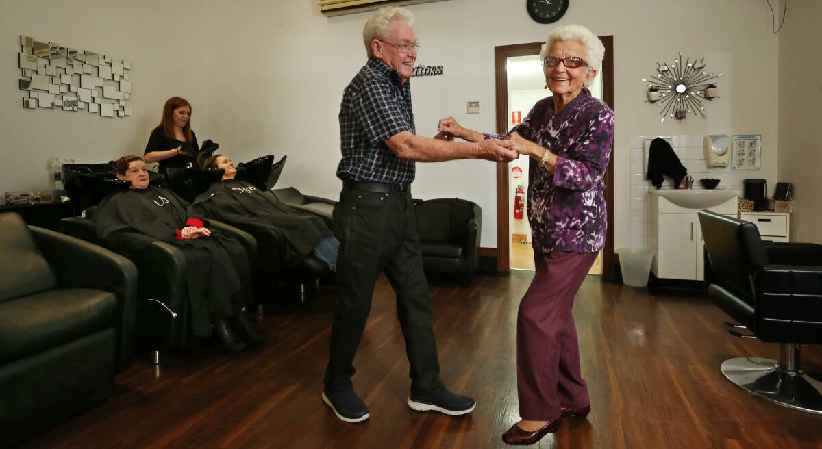 DANCING DAPHNE: Robert Threlfo, 73, of Inspirations Hair Design with his client and dance partner Daphne Partridge, 93. Picture: Simone De Peak.