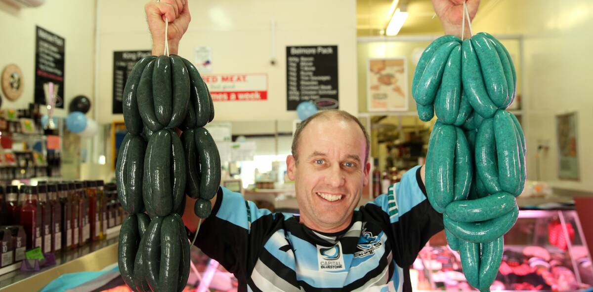 SHARK SAUSAGES: Lorn Butchery owner Darren Davidson and his Shark inspired snags. PICTURE: Max Mason-Hubers.