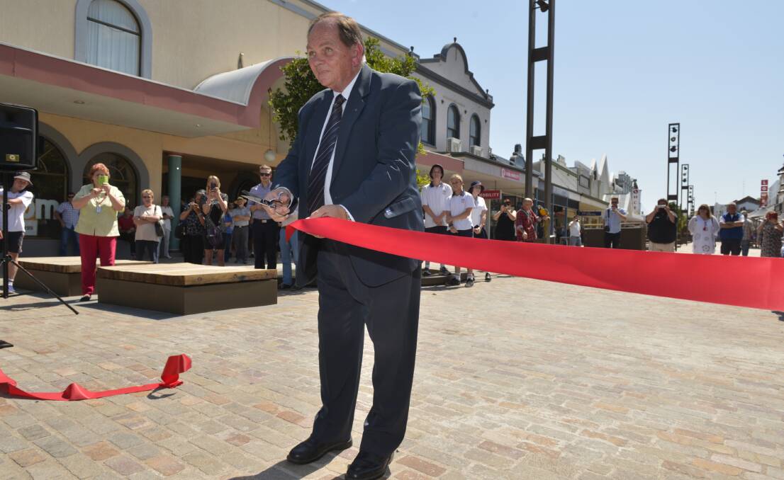 IMPRACTICAL: Maitland mayor Cr Peter Blackmore opens The Levee, which according to John Lee, has seating that is too low for seniors to sit on.