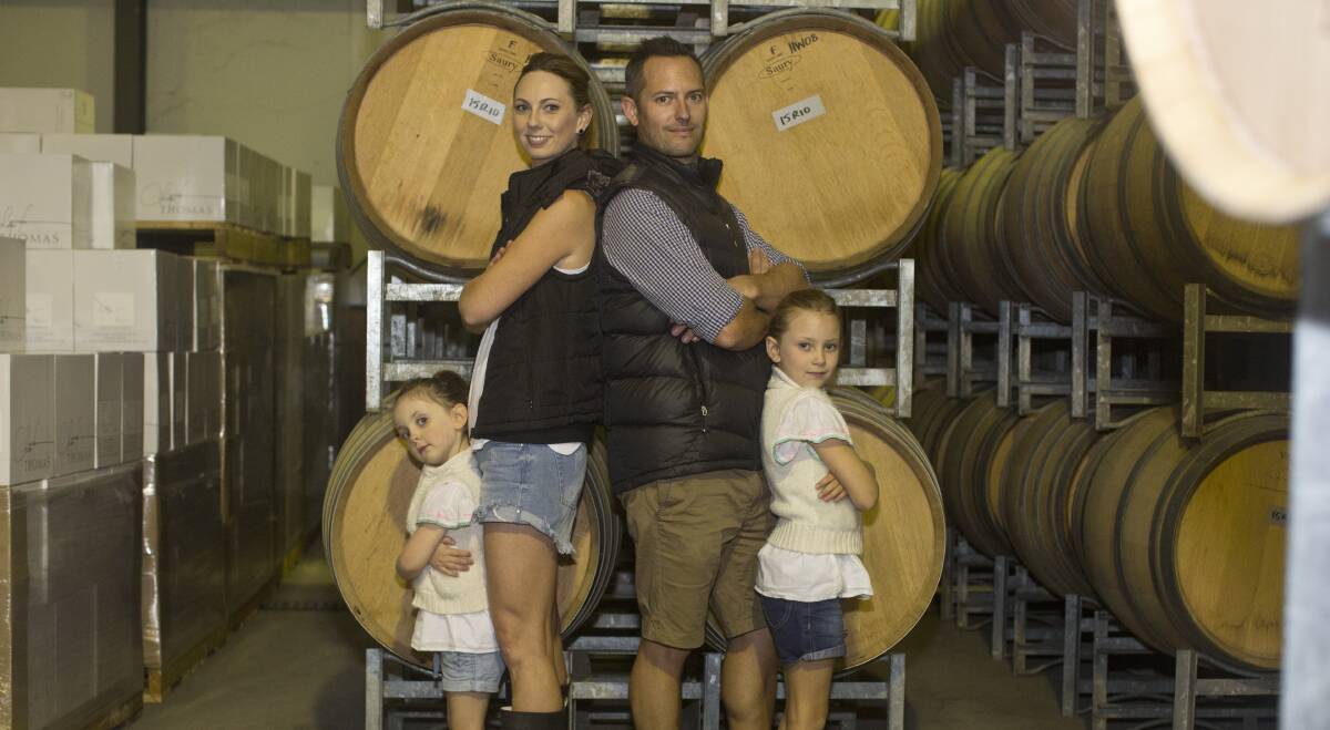 FAMILY AFFAIR: Scott Comyns with his wife Missy and daughters Topsy, 4, and Polly, 7. 