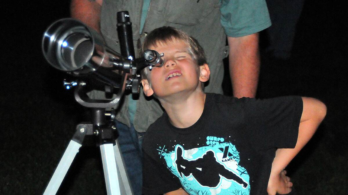 NEVER TOO YOUNG: A young sky gazer amazed by what's overhead. 