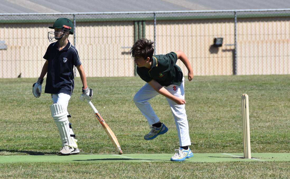 Quick: Clarence Town bowler Lucas Hawkin throws a ball down in the Reg Kelly Shield clash between Hunter Valley Grammar and Clarence Town. Picture: Michael Hartshorn 