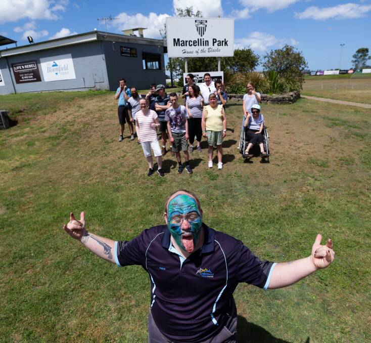Stoked: Endeavour's Adam 'Pop' Davis didn't need much encouragement to be front and centre of a photo at the group's temporary home at Marcellin Park. Picture: Jonathan Carroll 