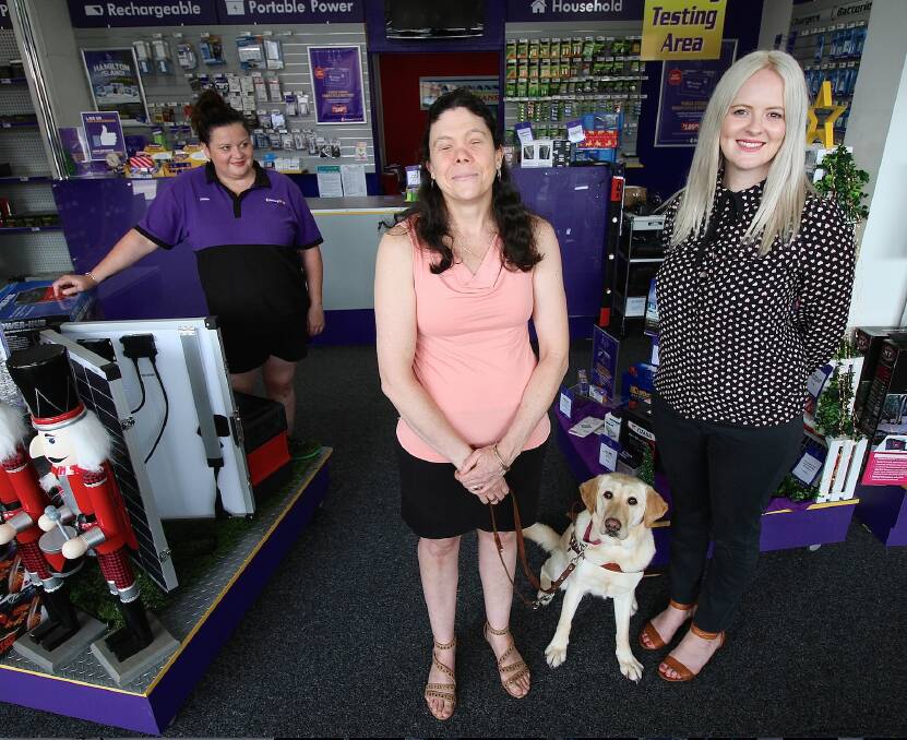 Winning name: Battery World's Katie Hallinan, Cathyrn Gilewski, Chloe the guide dog and naming competition winner Abby Hallet. 