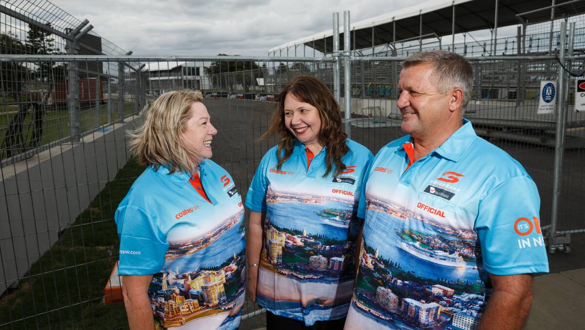EXCITED: Suzy Moffitt, centre, with Linda and Allan Locking at the Newcastle Supercars track near Nobbys. Picture: Max Mason-Hubers
