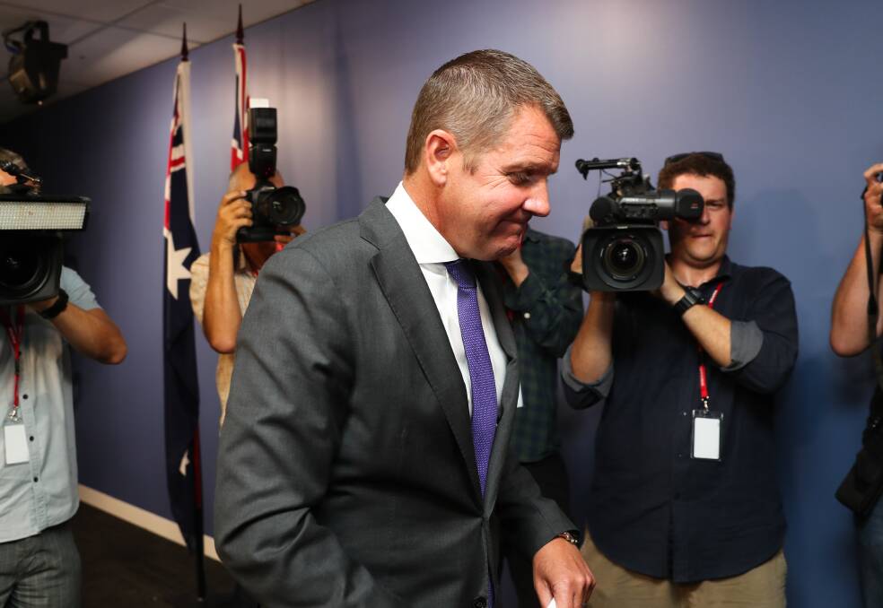 Premier Mike Baird leaves a press conference after announcing his resignation in Sydney. Picture: Janie Barrett