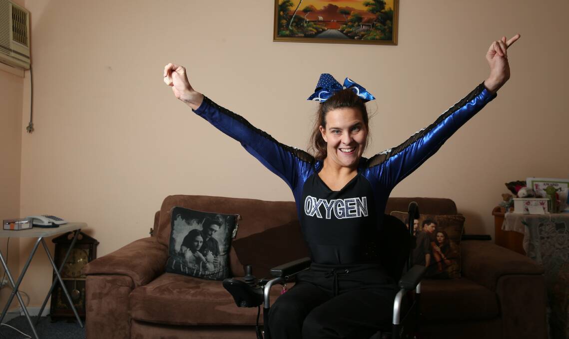 CHAMPION:  Debbie Threlfo celebrates her cheerleading success at home in Mayfield. Picture: Max Mason-Hubers
