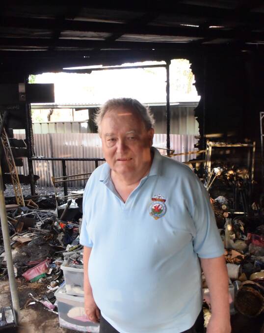 TERRIBLE DAY: Graham Smith stands in his charred backyard workshop, which came under ember attack as fire burned on Northcote Street. Picture: Brodie Owen
