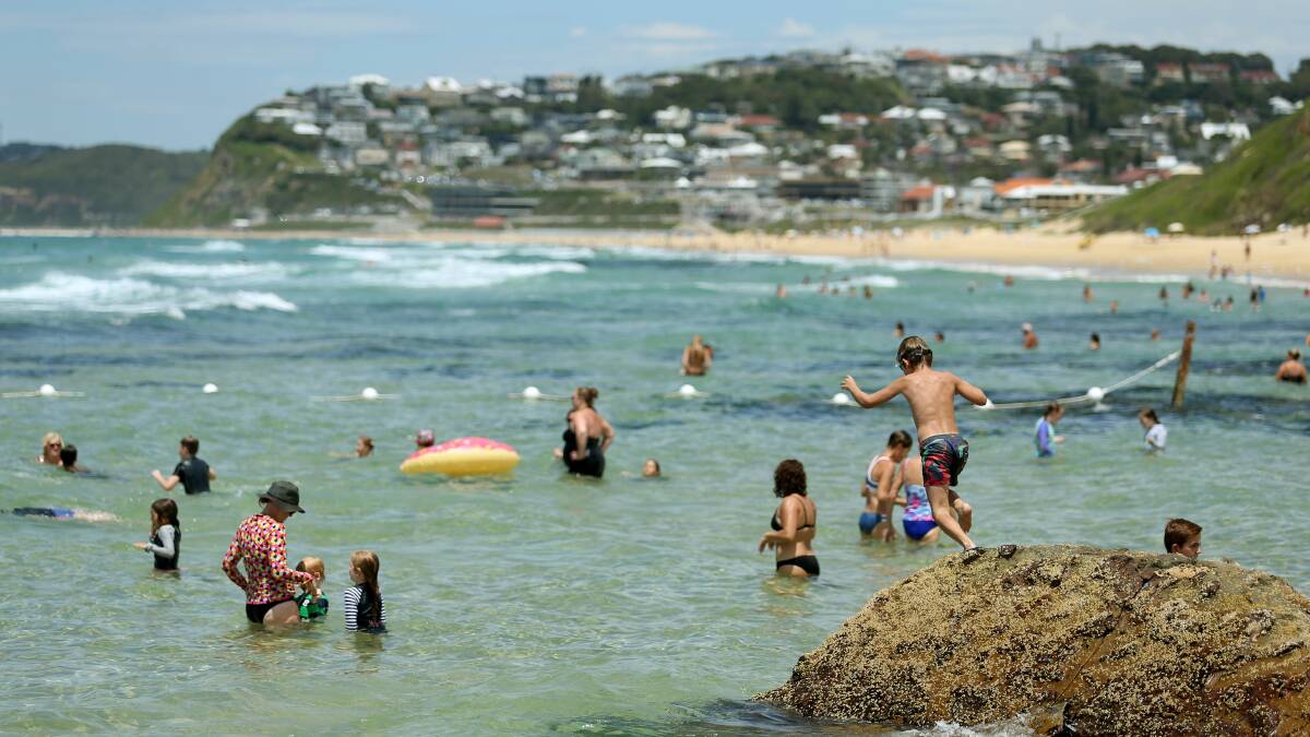IN FOR A SWIM: Crowds at Bar Beach. Picture: Marina Neil