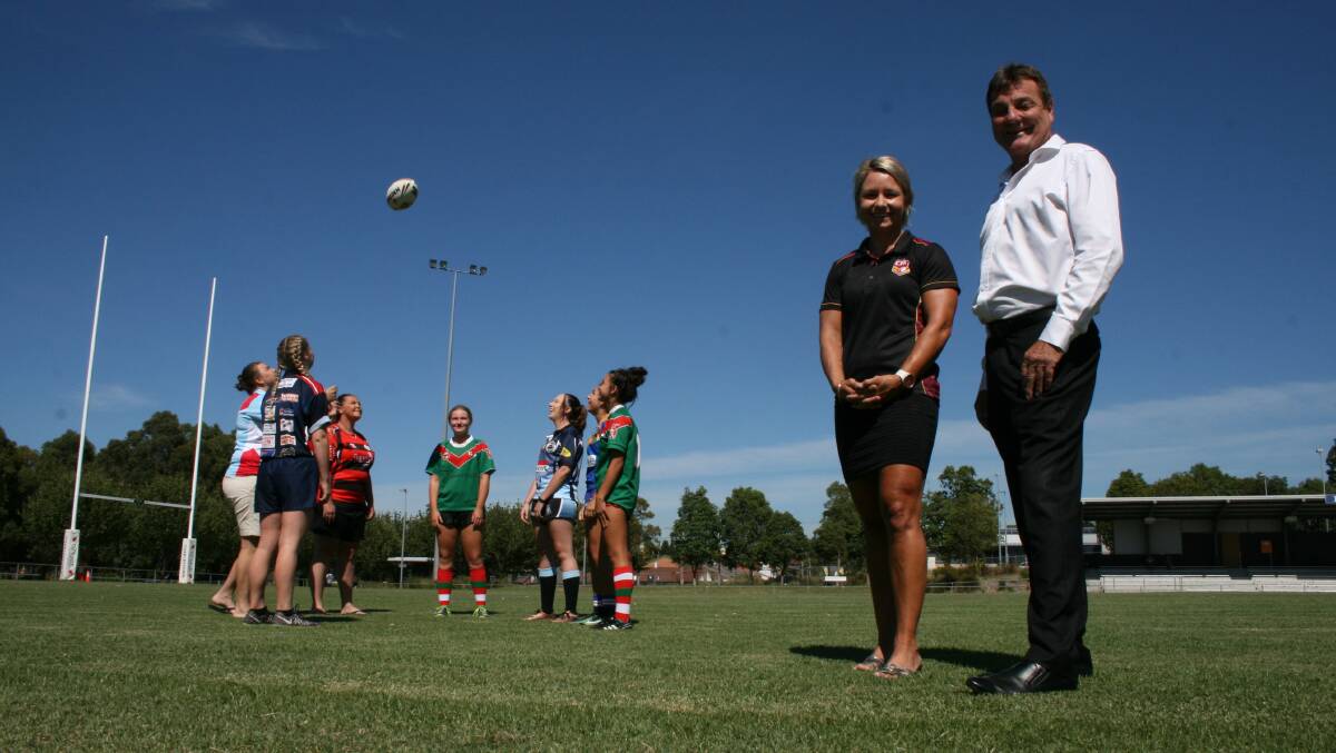 LAUNCH: Country Rugby League officials Kylie Hilder and Bert Lowrie at St John Oval on Thursday with players already signed up for the new all-women's Central Hunter Combined Competitions. Picture: Josh Callinan