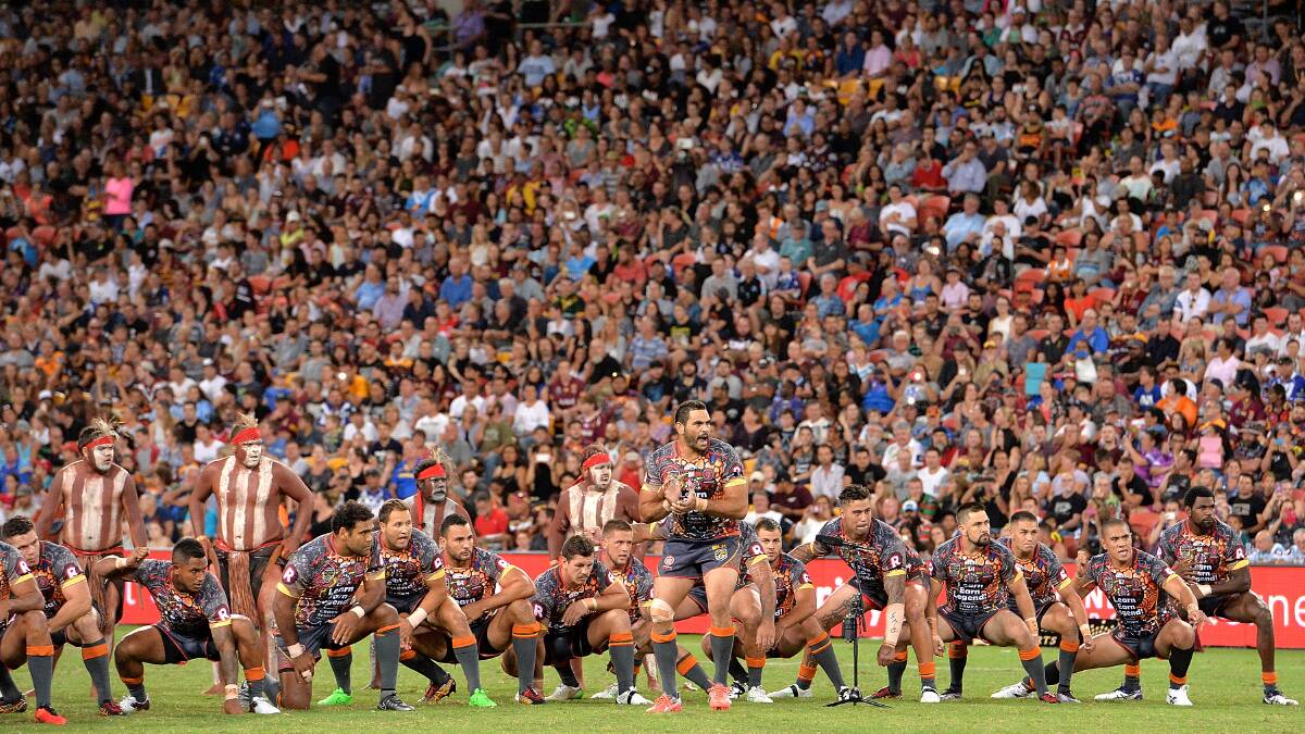 CROWD: Greg Inglis leads the pre-game dance before last year's NRL All Stars game in front of 37,339 fans at Brisbane's Suncorp Stadium. Picture: Getty Images.