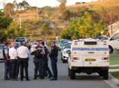 Police at Boolaroo on Monday evening. Picture by Peter Lorimer