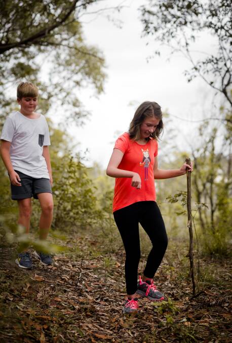 PREPARATION: Maddie and her brother Connor bushwalking near their Thornton home. They will ascend Mt Kosciuszko in February. Picture: Perry Duffin