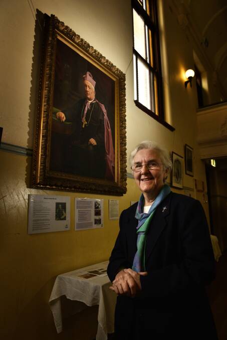 HISTORY: Sister Patricia Egan in front of a portrait of Bishop James Murray at the pop-up exhibition opening. Picture: PERRY DUFFIN