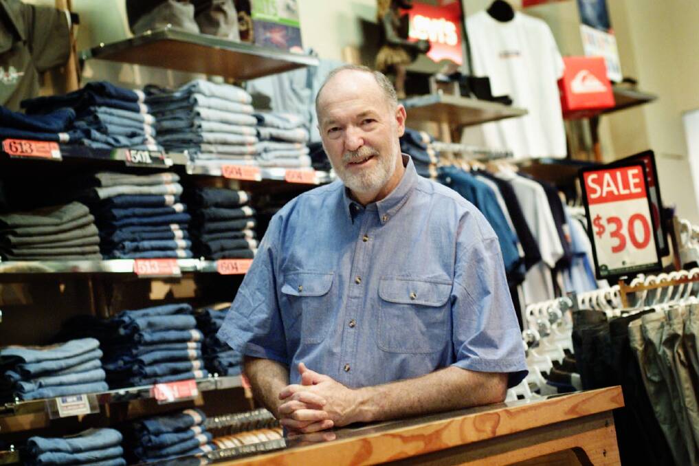 HISTORY: John Lane standing in Ken Lane Menswear in the early 2000s. The Lane family are central figures in Maitland's business community. Picture: Fairfax Media