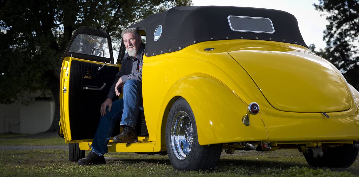 MELLOW YELLOW: Maitland Street Rodders vice president Noel McTaggart with his 1937 Ford Roadster. Picture: PERRY DUFFIN