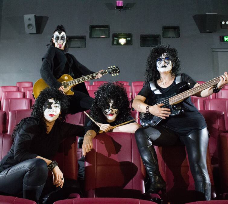 ROCK N' ROLL: Maitland Reading Cinema staff Ebony Love, Jack Fisher, Susan Beer and Yvette Cavanagh dressed as the iconic KISS. Picture: MICHAEL JOHN FISHER