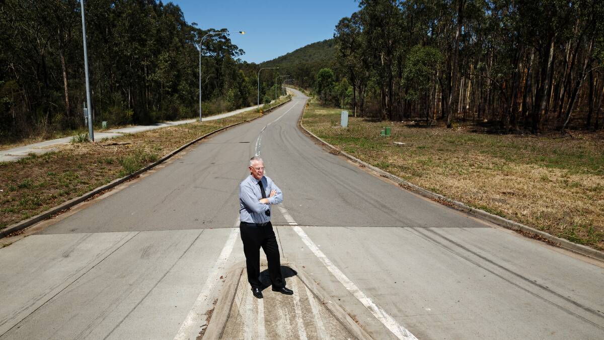 EMPTY: Cessnock mayor Bob Pynsent stands in the Hunter Economic Zone. Decades after its proposal, the zone is almost empty and riddled with waste. Picture: Max Mason Hubers