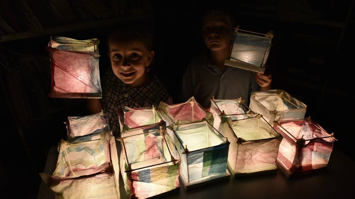 RIVERLIGHTS: Iona Public School students Isabella and Felix with some colourful lanterns from last year's workshops. Picture: FAIRFAX MEDIA