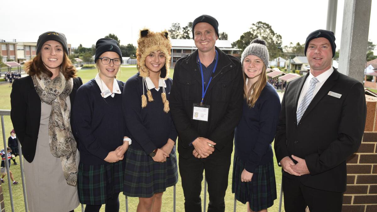 ALMA MATER: Mark Hughes with students and teachers at St Peter's Catholic high school in Maitland for Beanies for Brain Cancer Week.