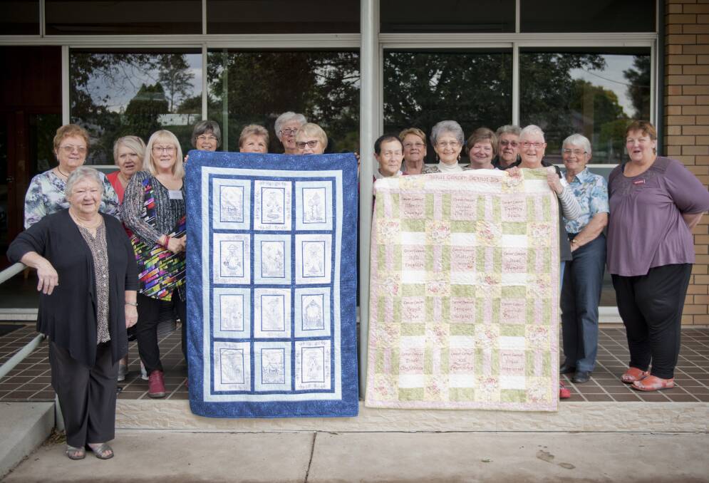 STITCHED: The Maitland Embroiderers Group with two quilts knitted to inspire hope, raise funds and awareness for those touched by cancer. 
