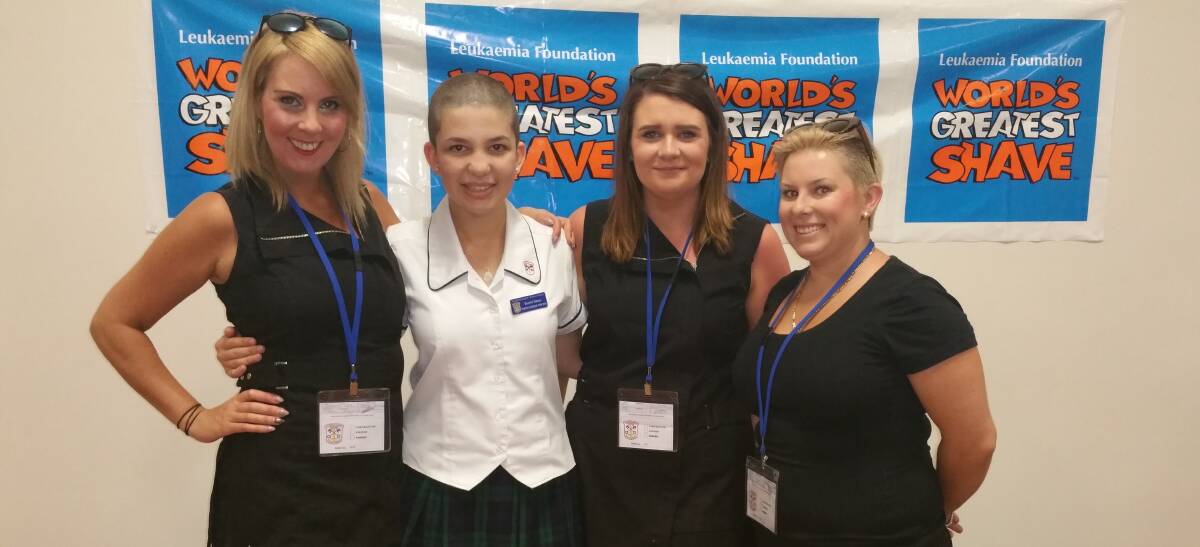 WORLD'S GREATEST: Raeshel Tabone (second from left) with the crew from Strand On High after having her head shaved for cancer at school. 