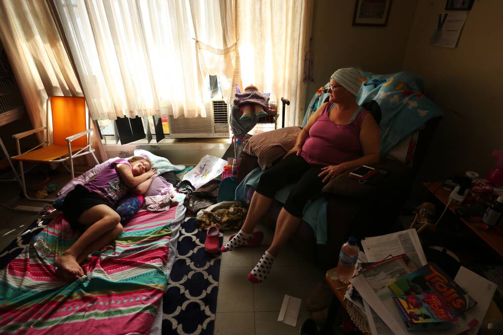 HOME: Karin watches her daughter Matilda lounge in the sun on a mattress in the living room. Karin was told in January her breast cancer had spread to her bones and liver. She has only months to live. Picture: Simone De Peak