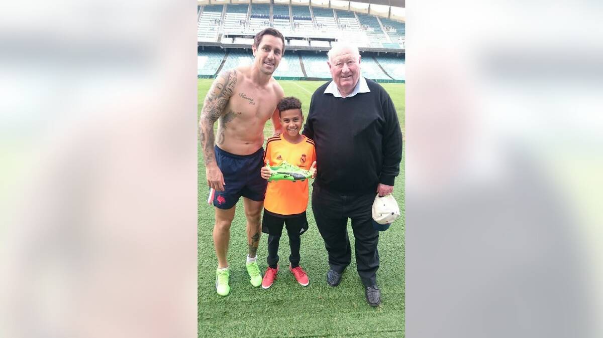 Mitchell Pearce with Allan Bell, and Bell's grandson, Everett. Picture: Supplied