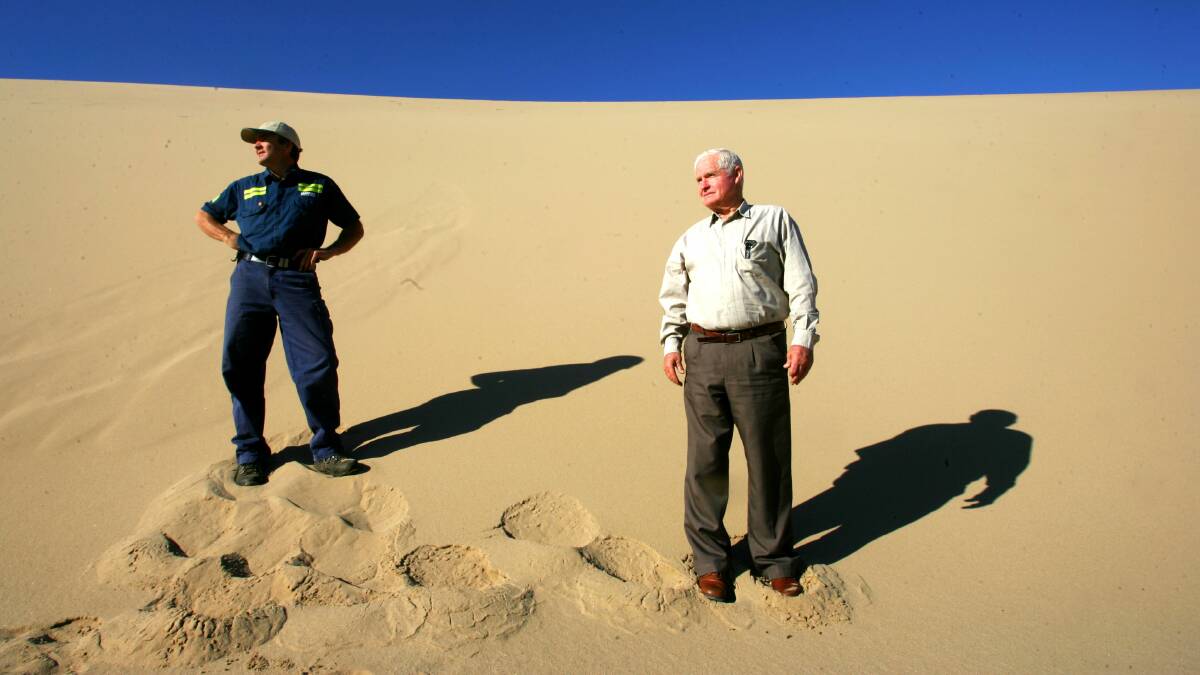 Fined: Macka's Sand and Soil owners Bruce and Robert MacKenzie on a sand dune that forms the basis of their business. 