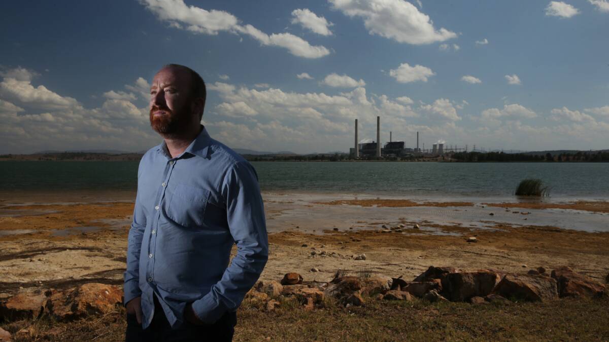 Warnings: Muswellbrook mayor Martin Rush beside Lake Liddell, made of water used by Liddell and Bayswater power stations. Mr Rush will tell a Senate inquiry its future rehabilitation is now up in the air. Picture: Simone De Peak 