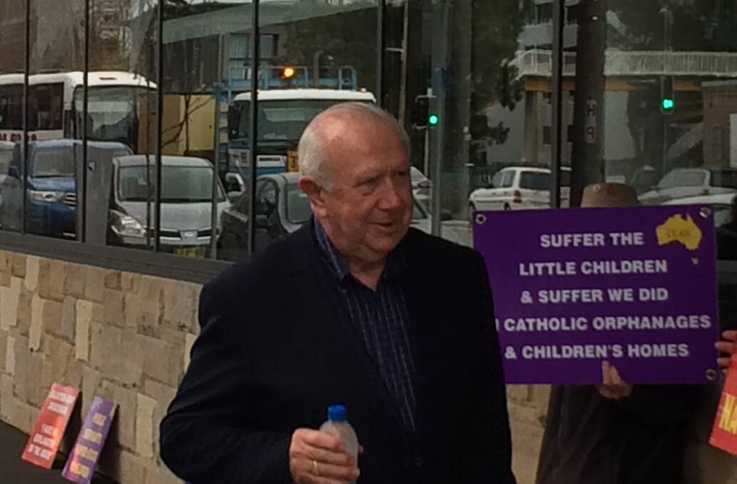 Bishop Brian Farran enters the royal commission hearing at Newcastle Courthouse.