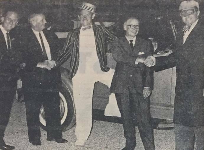  A photo from the 1967 opening night, appearing in the Cessnock Advertiser. The caption read: Mr. Ray Smith, at left, with general manager of National Theatre Supplies, with the manager of the new Heddon Greta Skyline Drive-In Theatre, Mr. Sam Robinson, Mr. Laurie Murphy, of Cessnock, the assistant to the exectutive director of the Greater Union Theatres organisation, Mr. H. G. Hayward, and Albert Bromage, of Cessnock, with a vintage car at the drive-in opening this week.
