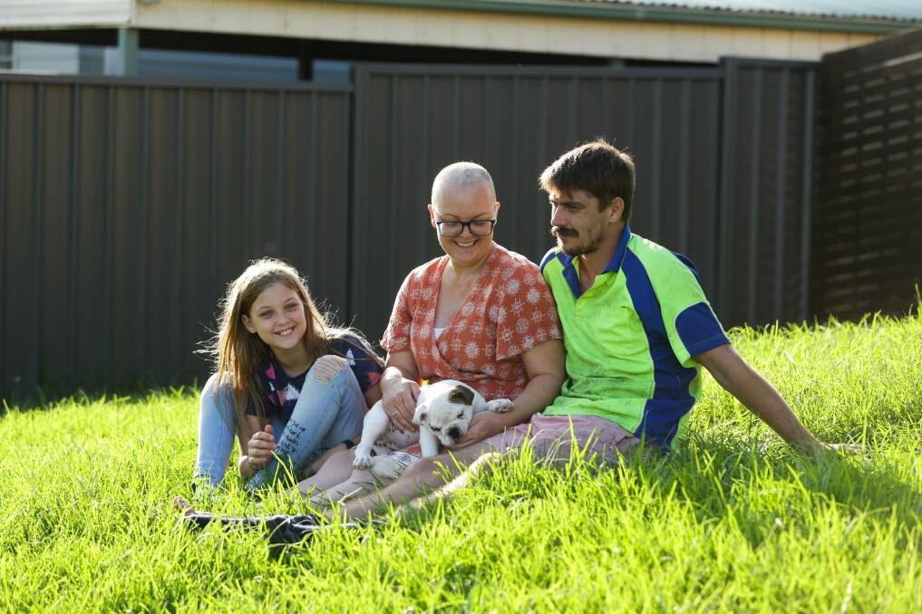 FAMILY IS EVERYTHING: Jessica Sidebottom (centre) with daughter Lacey, husband Luke, and Booger the dog. Picture: Jonathan Carroll