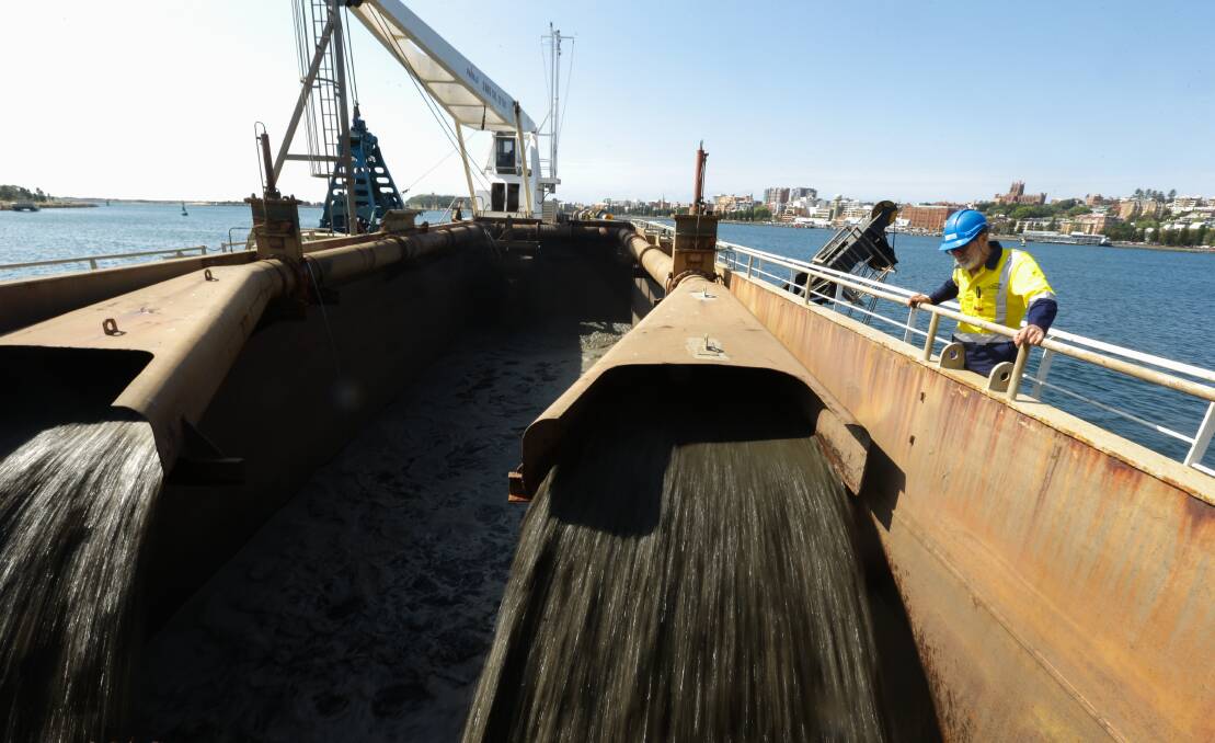 MAKING WAY: Silt and water sucked from the bottom of the shipping channel in Newcastle harbour pour into the hopper of "David Allan". Pictures: Jonathan Carroll