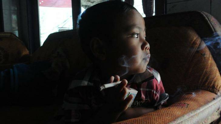 Muhammad Dihan Awalidan, 4, is part of Indonesia's smoking epidemic. Photo: Michael Bachelard