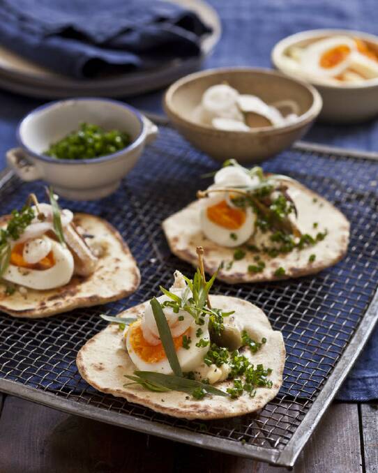 Pita with crab, egg, soft herbs and caperberries <a href="http://www.goodfood.com.au/good-food/cook/recipe/pita-with-crab-egg-soft-herbs-and-caperberries-20130124-2d8ar.html"><b>(RECIPE HERE).</b></a> Photo: Marina Oliphant