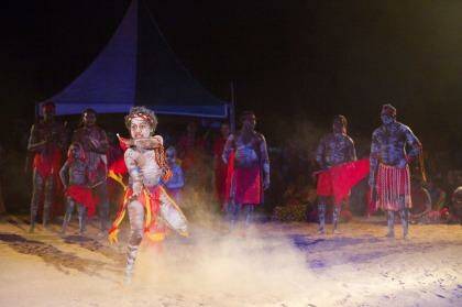 A boy performs with the Red Flag Dancers, a group from the Arnhem Land community of Numbulwarr. Photo: Andrew Bain