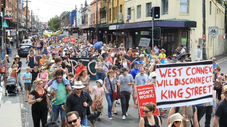 Concerned residents take to the streets of Newtown, Sydney, on Sunday to protest the proposed development of the NSW government's WestConnex tunnel and road project. Photo: James Alcock