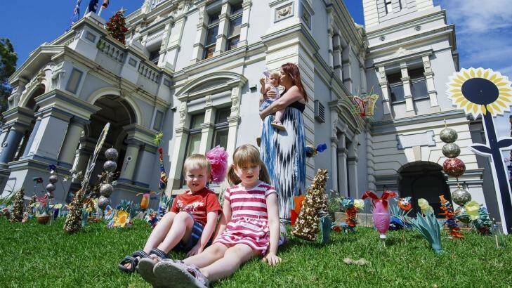 Kate Walsh with her children, Quinn five; Aidan, four; one-year-old Niamh at Leichhardt Town Hall after school care. Photo: Christopher Pearce