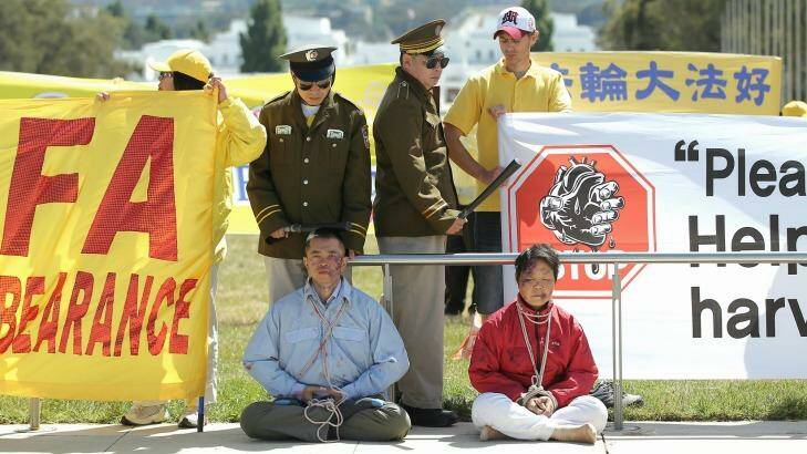 Falun Dafa protesters out the front of Parliament House for the visit by Chinese President Xi Jinping. Photo: Alex Ellinghausen